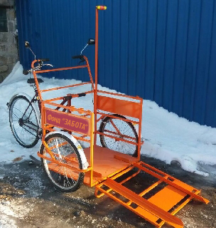 Велорикша для перевозки инвалидов-колясочников